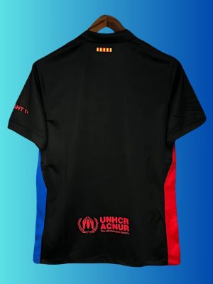 2024 Barça away kit in black with red-blue gradient crest