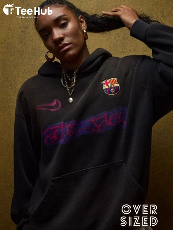 Model wearing oversized Travis Scott Barça hoodie with Camp Nou in background teehub hoodei travis scott