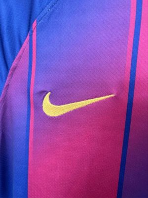 Close-up of the FC Barcelona 2025/26 jersey badge and Nike logo