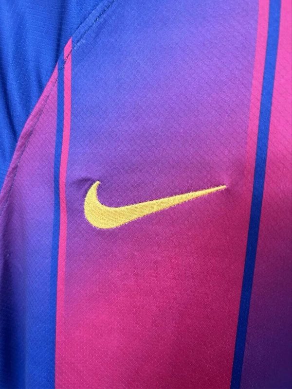 Close-up of the FC Barcelona 2025/26 jersey badge and Nike logo