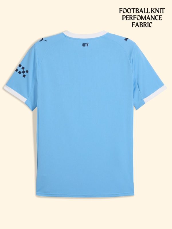 Manchester City 2025-26 home fan kit on model with full-body view.