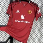 Manchester United 25/26 home jersey with red base and black trim