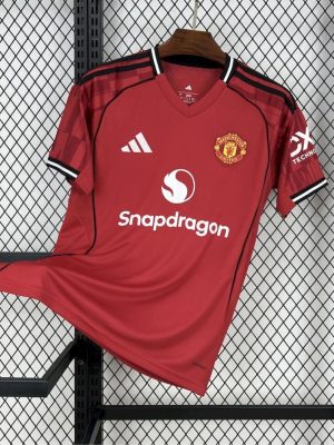 Manchester United 25/26 home jersey with red base and black trim