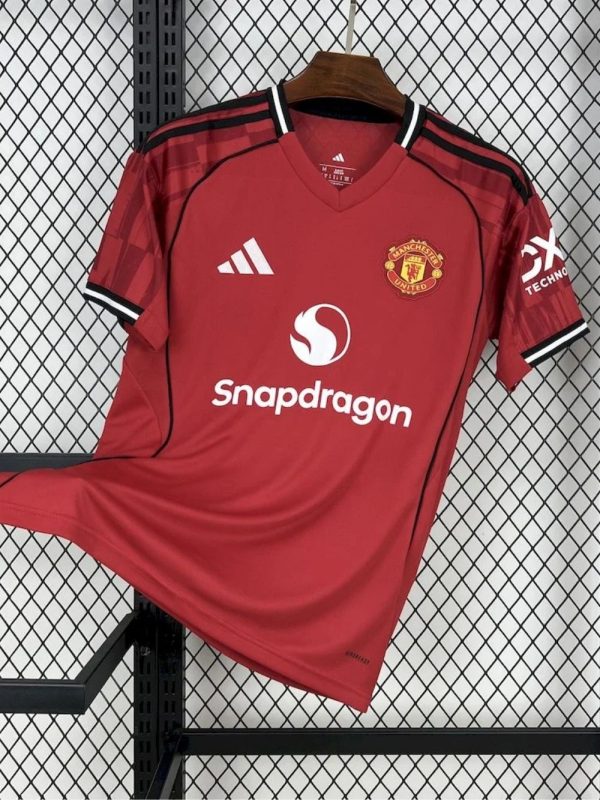 Manchester United 25/26 home jersey with red base and black trim