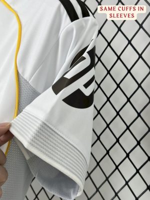 Close-up of the Real Madrid 25/26 jersey badge and embroidered details. real madrid jersey teehub