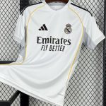 Real Madrid 25/26 home jersey with gold accents and sleek collar.