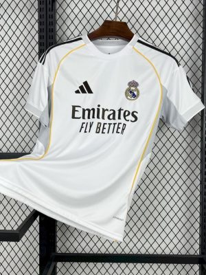 Real Madrid 25/26 home jersey with gold accents and sleek collar.